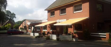 A brick building with a sign reading "Landhaus Wachendorf."
