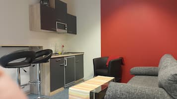 Suite, 1 Schlafzimmer | Wohnbereich | LED-Fernseher