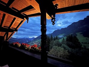 A wooden structure with a view of a mountainous landscape.