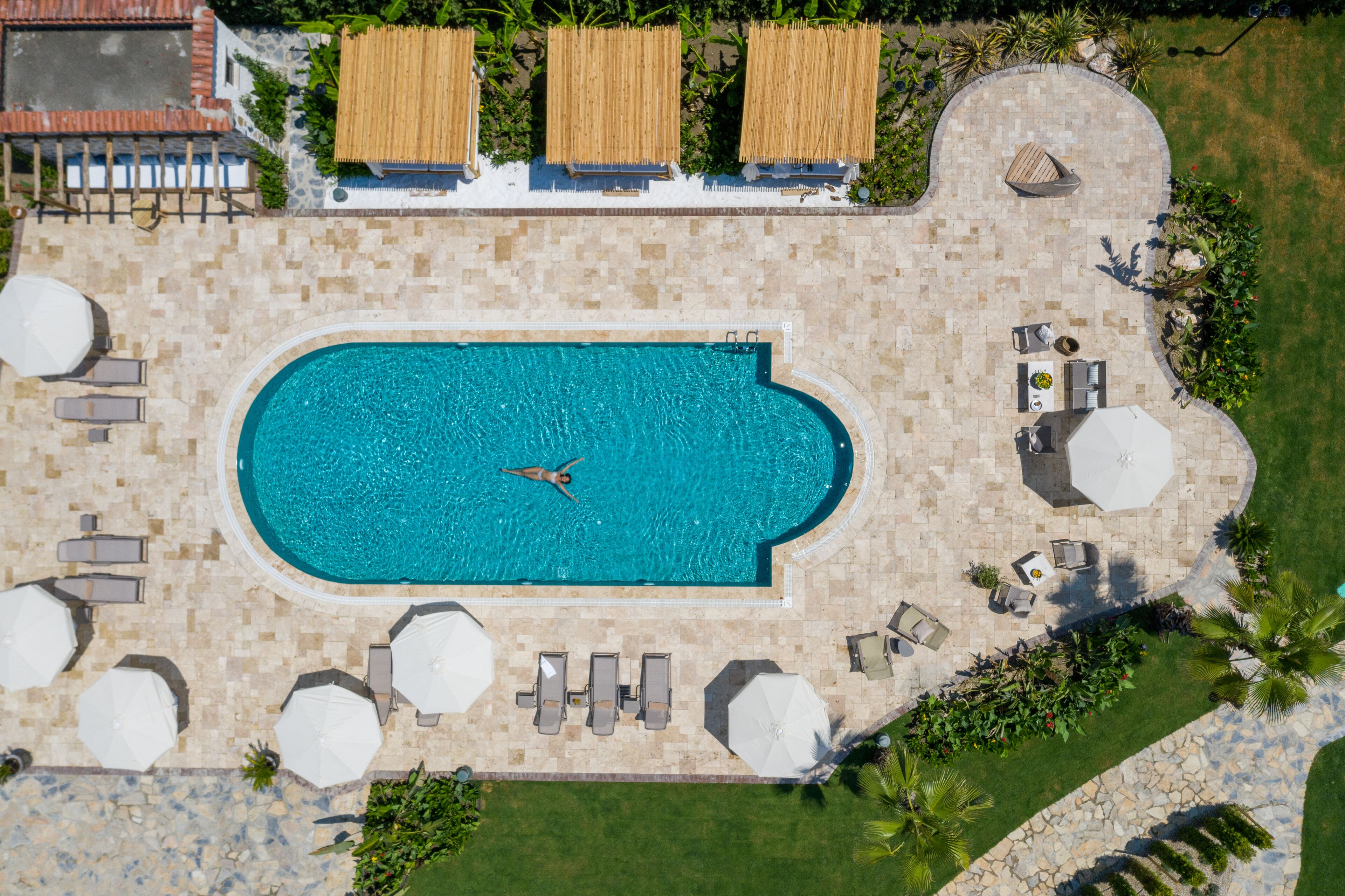 Seasonal outdoor pool, open 10:00 AM to 8:00 PM, pool umbrellas