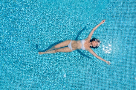 Seasonal outdoor pool, open 10:00 AM to 8:00 PM, pool umbrellas