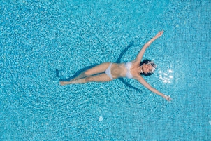 Seasonal outdoor pool, open 10:00 AM to 8:00 PM, pool umbrellas