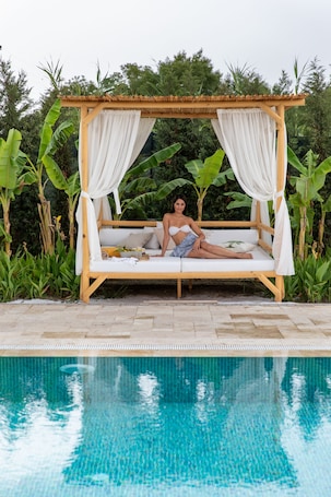 Seasonal outdoor pool, open 10:00 AM to 8:00 PM, pool umbrellas