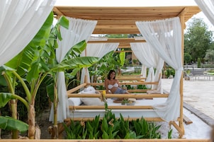 Seasonal outdoor pool, open 10:00 AM to 8:00 PM, pool umbrellas