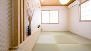 A traditional Japanese room with tatami flooring, a shoji screen, and a hanging paper lantern. - Mt. Fuji Akatsuki Enn (Fujikawaguchiko)
