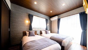 A modern hotel room with two beds, wooden flooring, and a large window with curtains. - Oriya Mt.Fuji -Nishiki- (Fujikawaguchiko)