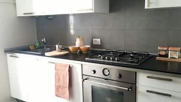 Apartment | Private kitchen | Full-size fridge, microwave, oven, stovetop