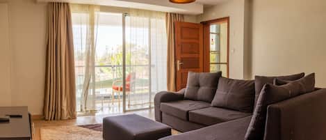Executive Apartment, 1 Bedroom | Living area | Flat-screen TV
