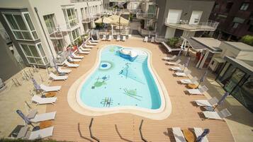Outdoor pool, open 10:00 AM to 7:00 PM, pool umbrellas, pool loungers