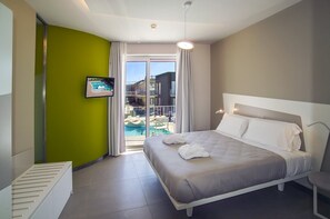 Apartament Deluxe | Caixa forta a l'habitació i escriptori 