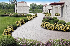 Stroll through the beautifully manicured garden to the traditional stone building.