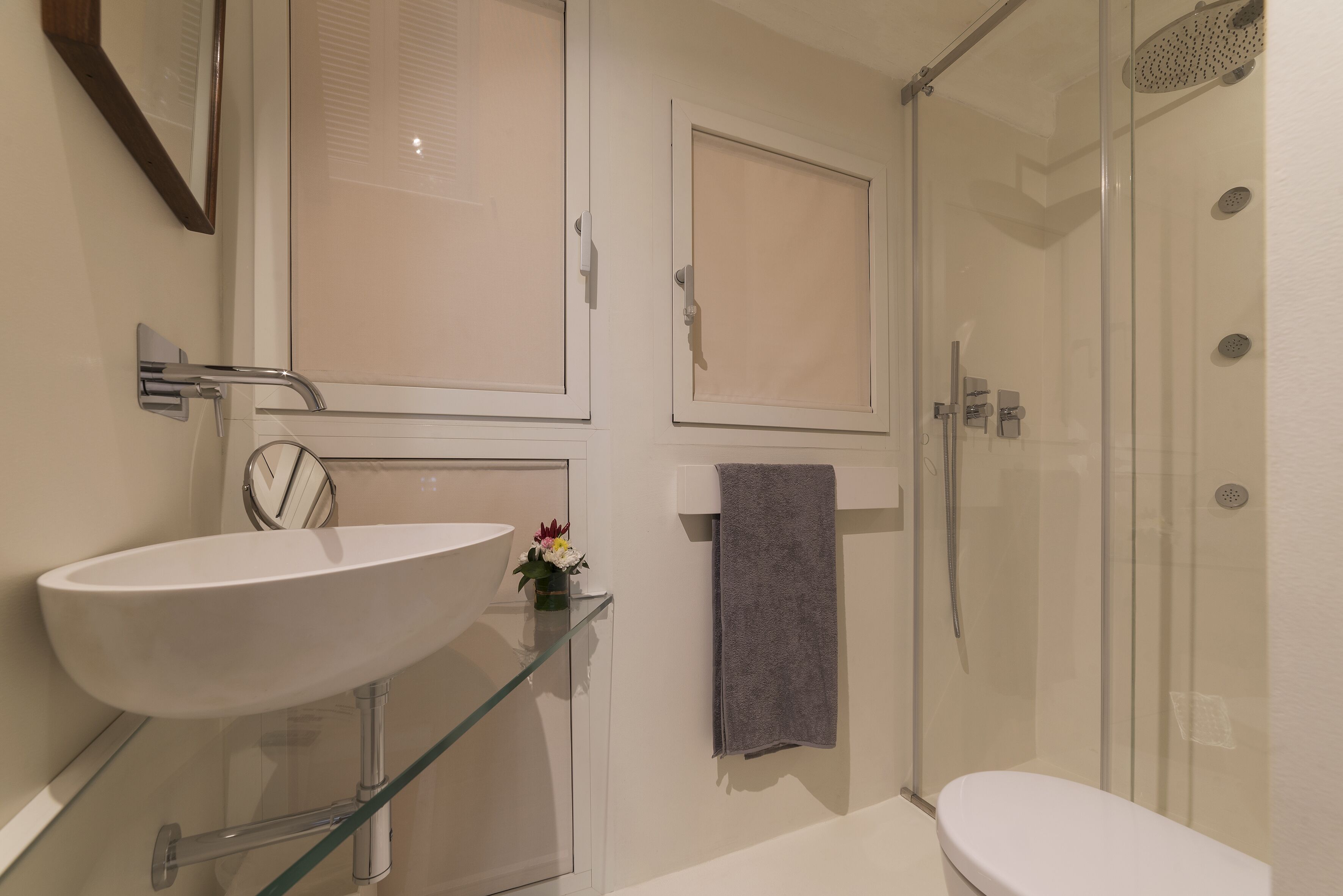 Shower, hair dryer, towels, toilet paper