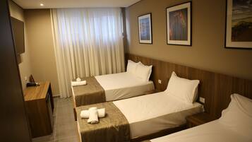 Standard Triple Room | 1 bedroom, minibar, in-room safe, individually decorated