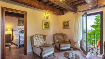 Apartment, 2 Bedrooms (Rondine) | Living area | 24-inch flat-screen TV with digital channels, TV, fireplace