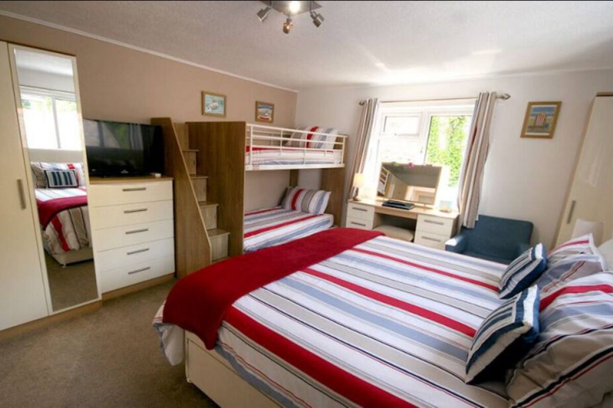 Family Quadruple Room | Hypo-allergenic bedding available, laptop workspace, blackout drapes