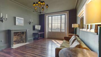 Apartment, 1 Bedroom | Living area | 32-inch flat-screen TV with digital channels, TV