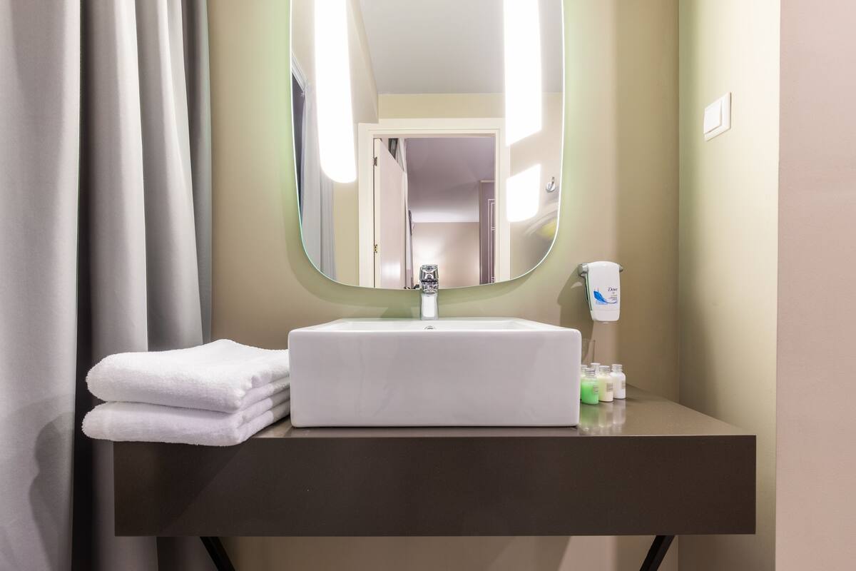 shower, eco-friendly toiletries, hair dryer, slippers