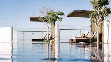 Outdoor pool, open 6:30 AM to 6:00 PM, pool umbrellas, sun loungers