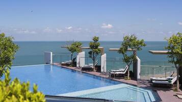 Outdoor pool, open 6:30 AM to 6:00 PM, pool umbrellas, pool loungers