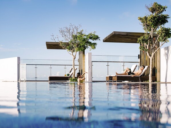 Outdoor pool, open 6:30 AM to 6:00 PM, pool umbrellas, pool loungers