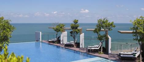 Outdoor pool, open 6:30 AM to 6:00 PM, pool umbrellas, pool loungers