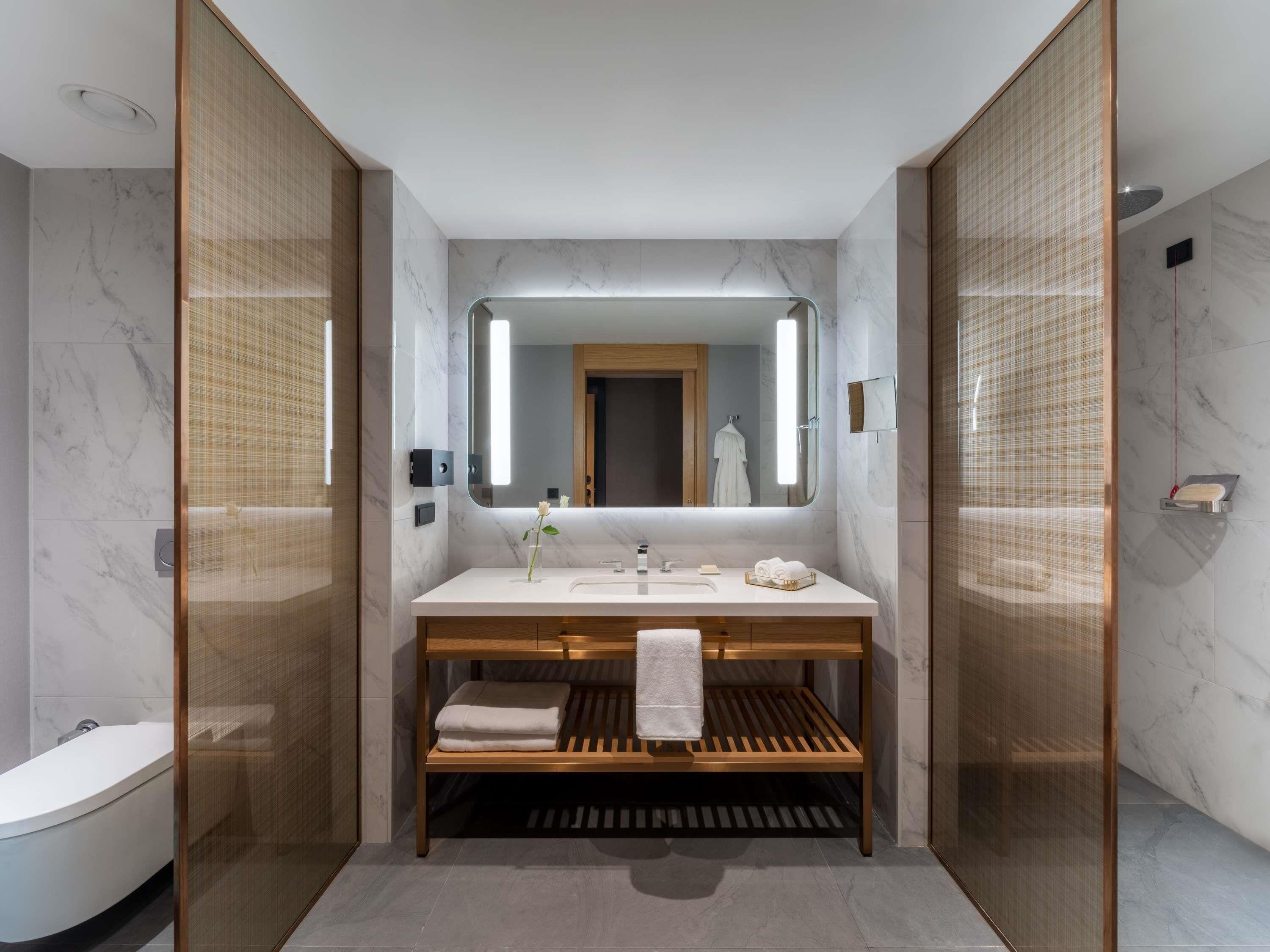 Designer toiletries, hair dryer, bathrobes, slippers