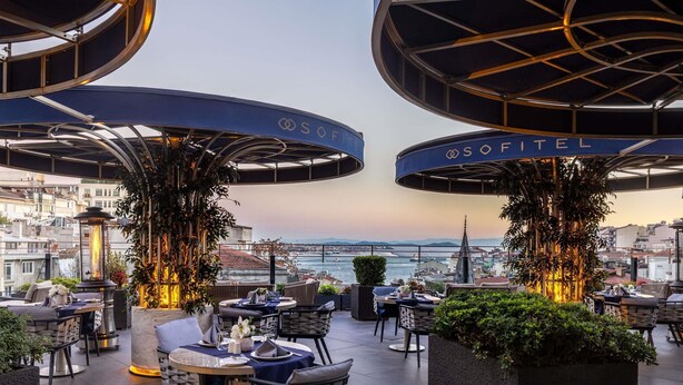 A rooftop terrace with outdoor seating, a view of the city, and the name 'SOFITEL' on the ceiling. - Sofitel Istanbul Taksim (Istanbul)