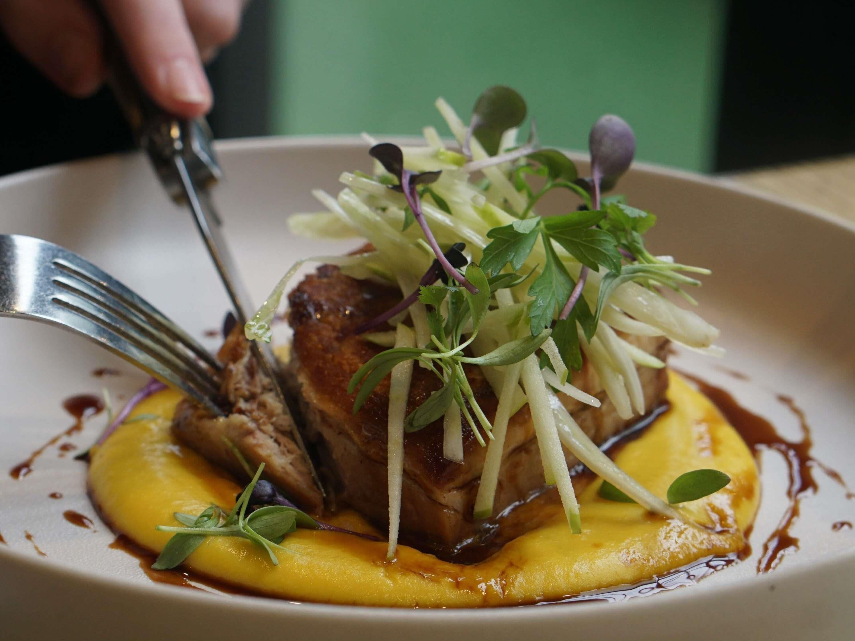 A plate of food with a fork.