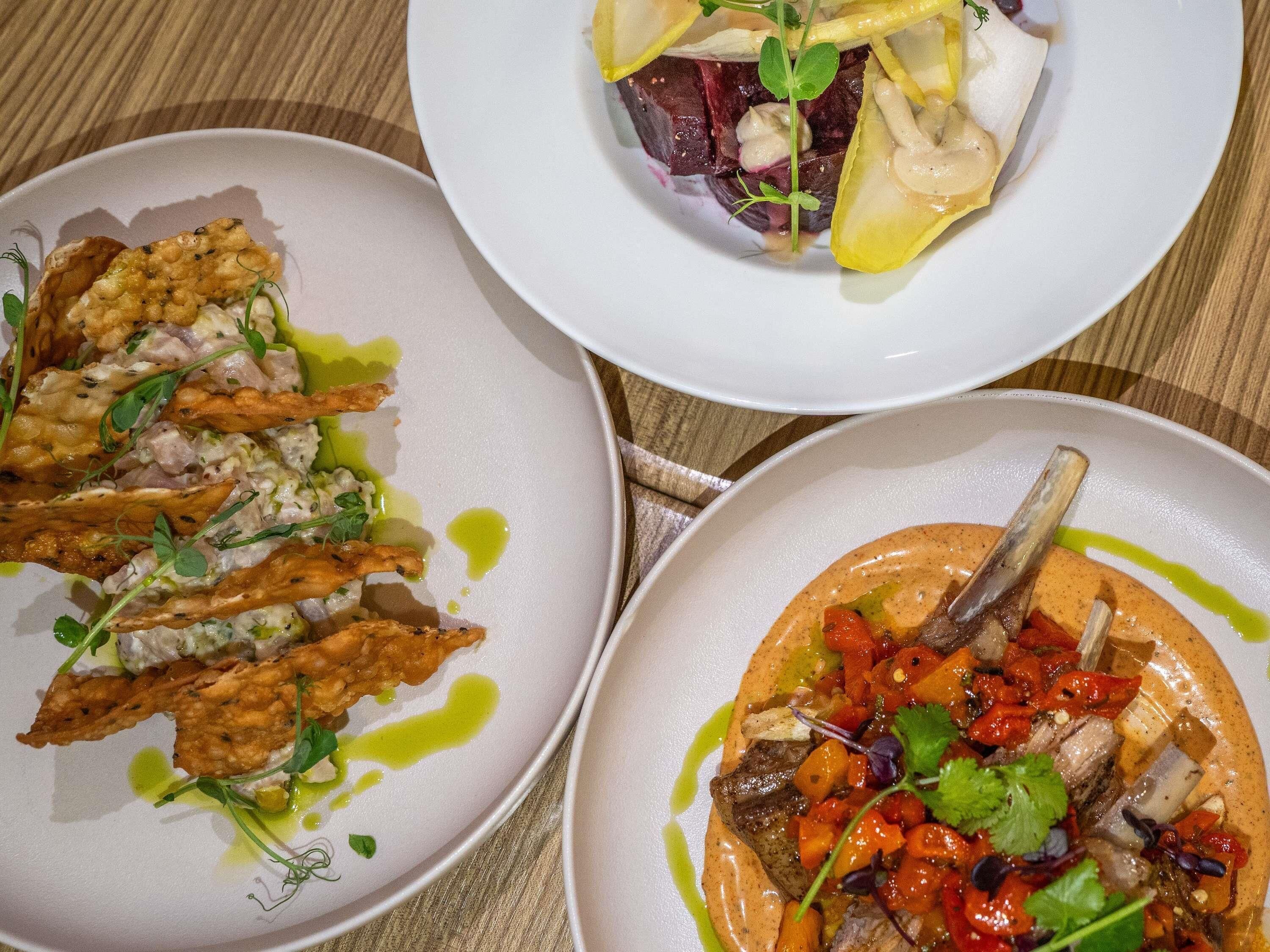 Three plates of food with various dishes.
