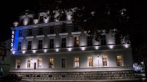 A hotel with a classic facade, multiple windows, and a prominent 'HOTEL' sign. - Hotel Central Park (Trebinje)