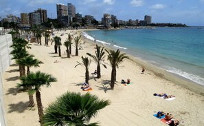 On the beach, sun loungers, beach towels