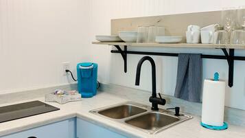 Fridge, microwave, stovetop, coffee/tea maker