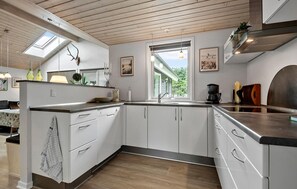 Fridge, stovetop, dishwasher, coffee/tea maker