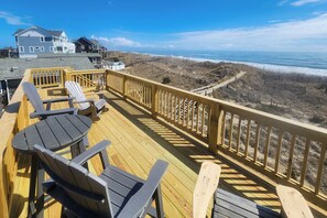 A wooden deck with outdoor seating and a view of the ocean. - 7916-Hatteras Vista - Oceanfront Hatteras Retreat w/ Hot Tub (Hatteras)