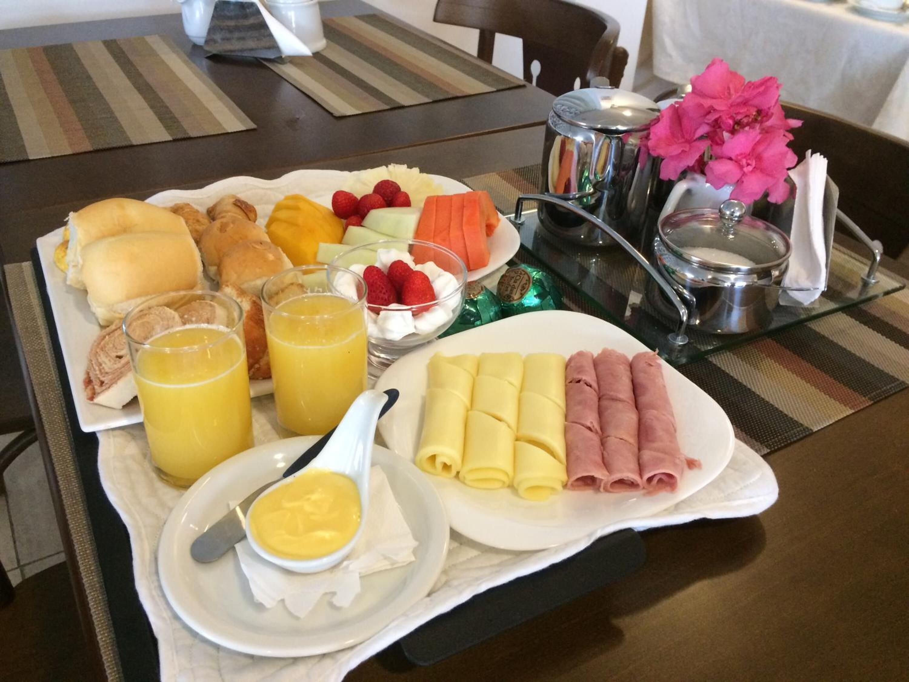 A breakfast buffet with various food items and beverages.