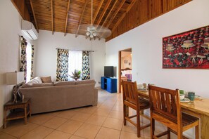 Tortuga Apartment | Living area | Flat-screen TV, DVD player - Seaside Inn (Roatan)