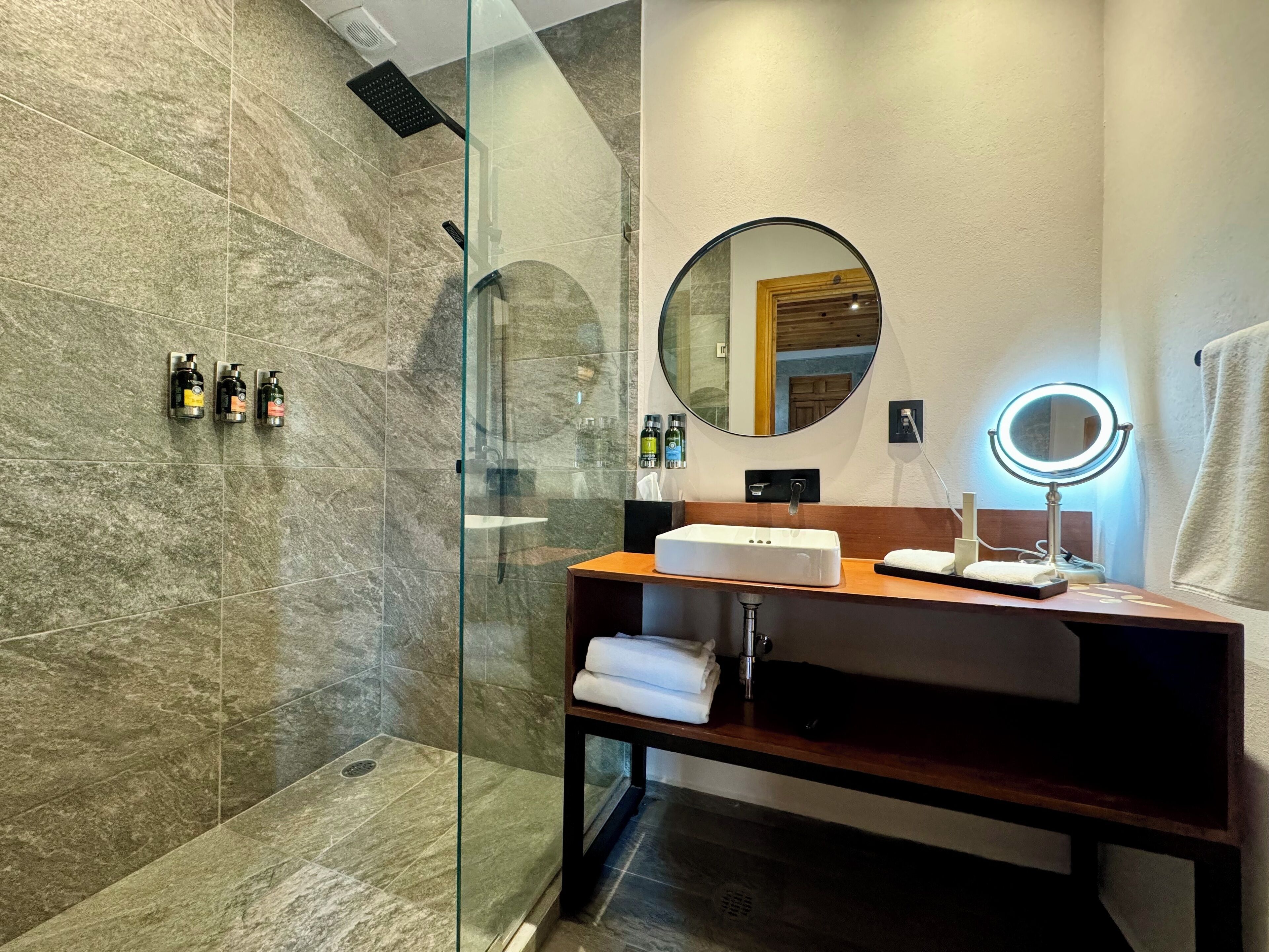 superior room 1 king bed | bathroom | shower, rainfall showerhead, free toiletries, hair dryer