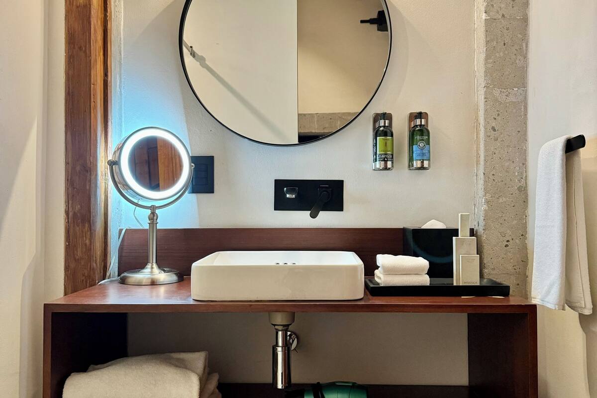 junior suite 1 queen bed | bathroom | shower, rainfall showerhead, free toiletries, hair dryer