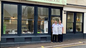 The exterior of Whortleberry Tea Room with large windows and a sign above the entrance. - Whortleberry Studio B&B (Minehead)