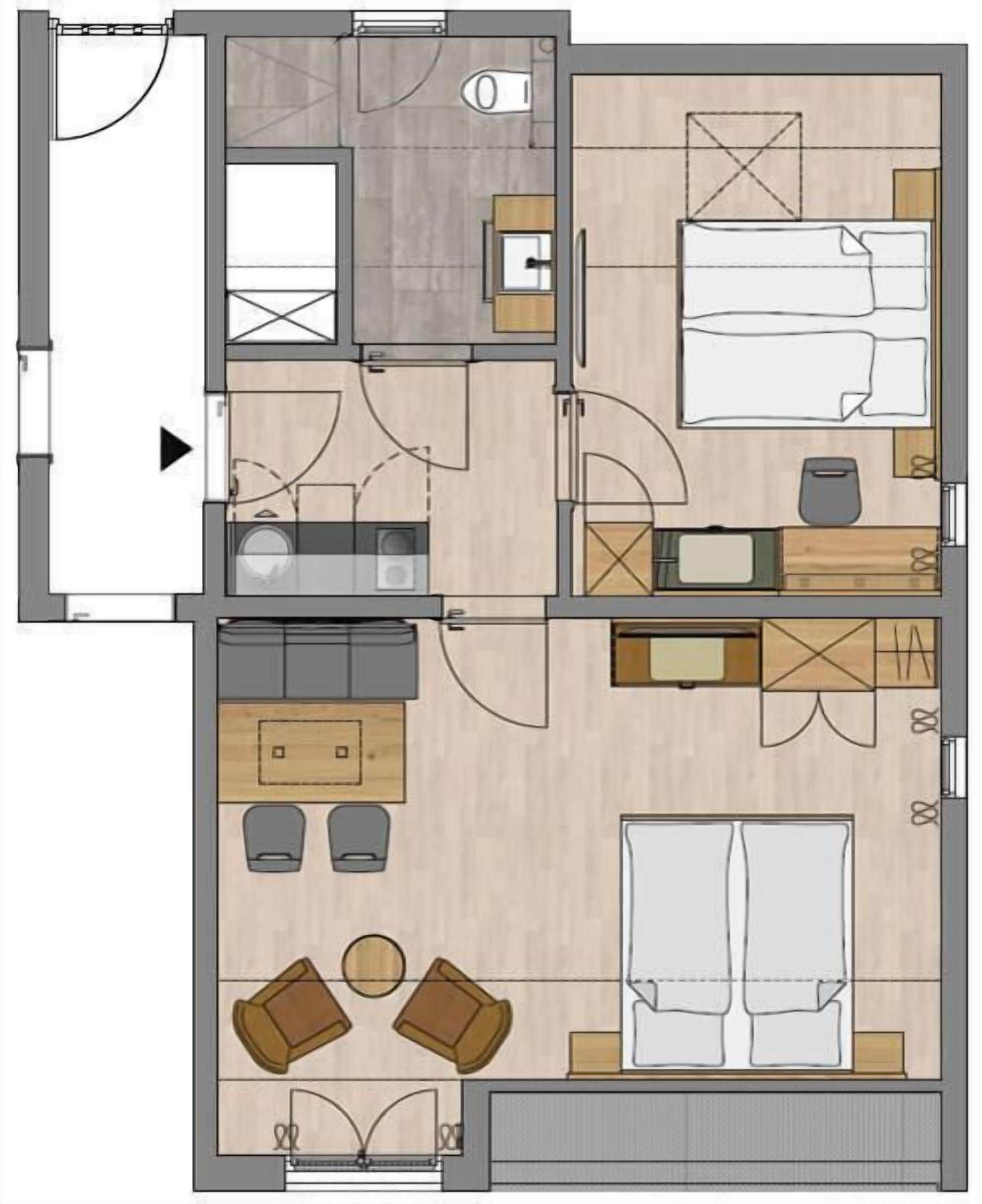 Ein Hotelzimmer mit Bett, Sitzgelegenheit, Küchenzeile und Bad.