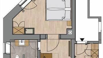 Plano de una habitación de hotel con cama, escritorio, silla, una pequeña cocina y baño.