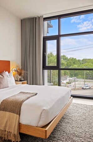 Roba de llit d'alta qualitat i caixa forta a l'habitació 