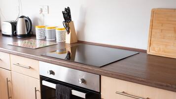 Three-Bedroom House | Private kitchen | High chair
