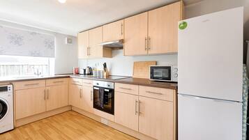 Three-Bedroom House | Private kitchen | Highchair