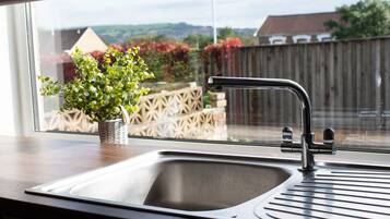 Three-Bedroom House | Private kitchen | Highchair