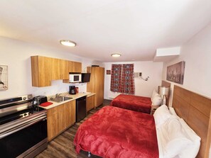 Comfort Quadruple Room | Premium bedding, memory foam beds, individually furnished, desk