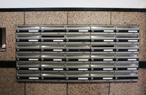 A wall of mailboxes with numbers 201 to 706, arranged in rows. - Grand Court Namba 402 (Osaka)