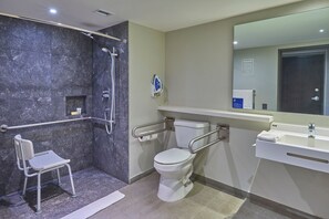 A modern bathroom with a shower, toilet, and sink. - City Express by Marriott Guaymas (Guaymas)