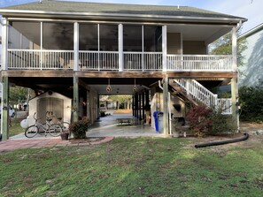 Enjoy a home away from home with a covered porch, staircase, and garden area.