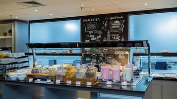 A breakfast buffet with various food items and beverages.